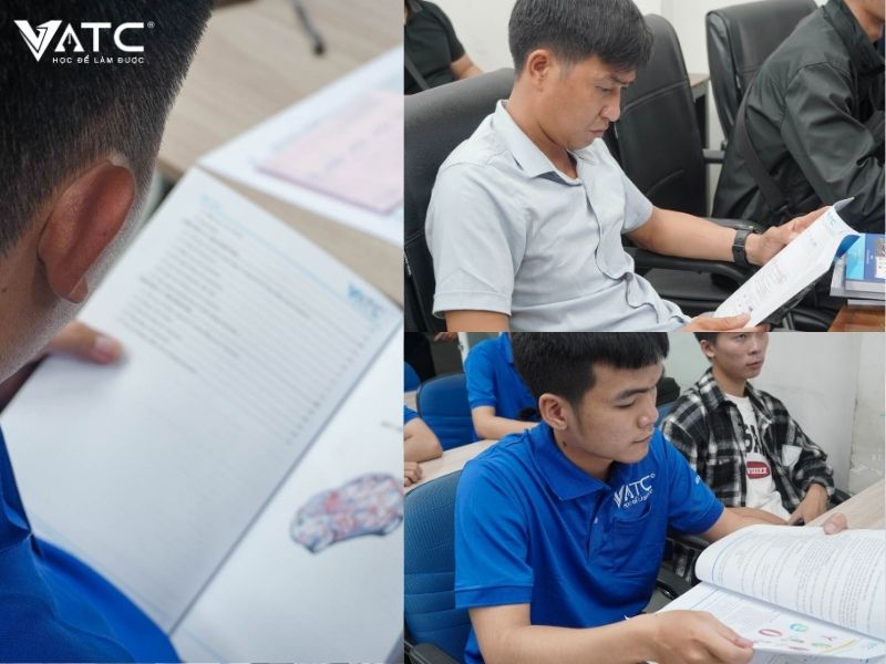 anh em học viên chăm chú đọc tài liệu trước buổi học đầu tiên